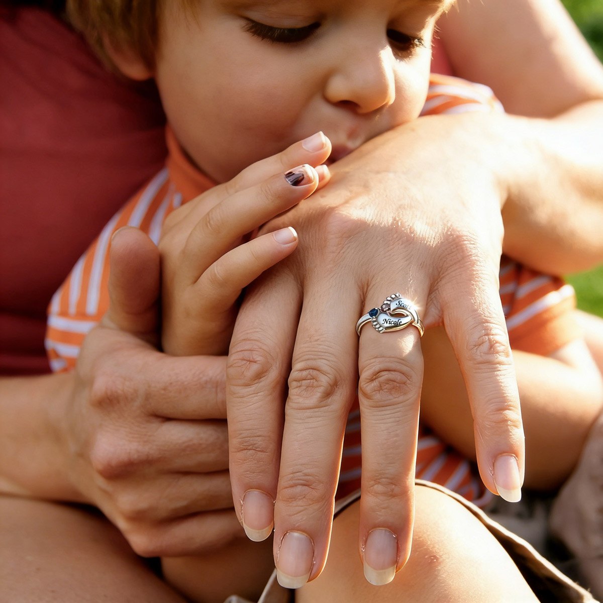 A Woman and kid Wearing Footprint Mother's Birthstone Ring with Names