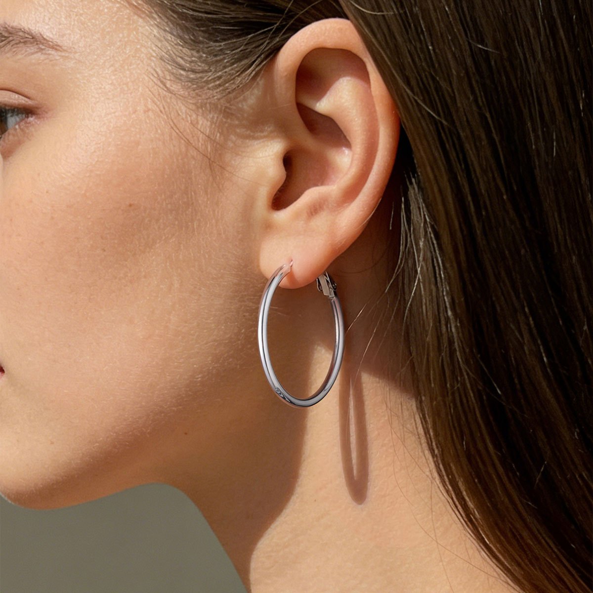 A Woman wearing Classic Statement Hoop Earrings for Women on the white background