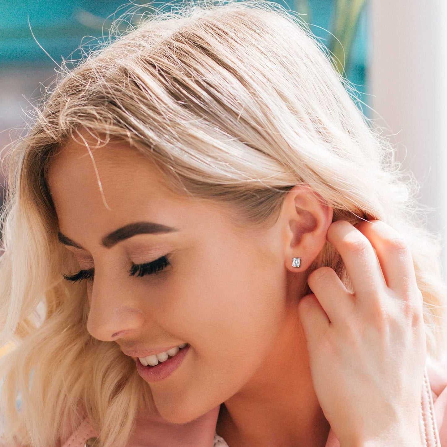 A Women Wearing  Emerald Cut CZ Stud Earrings