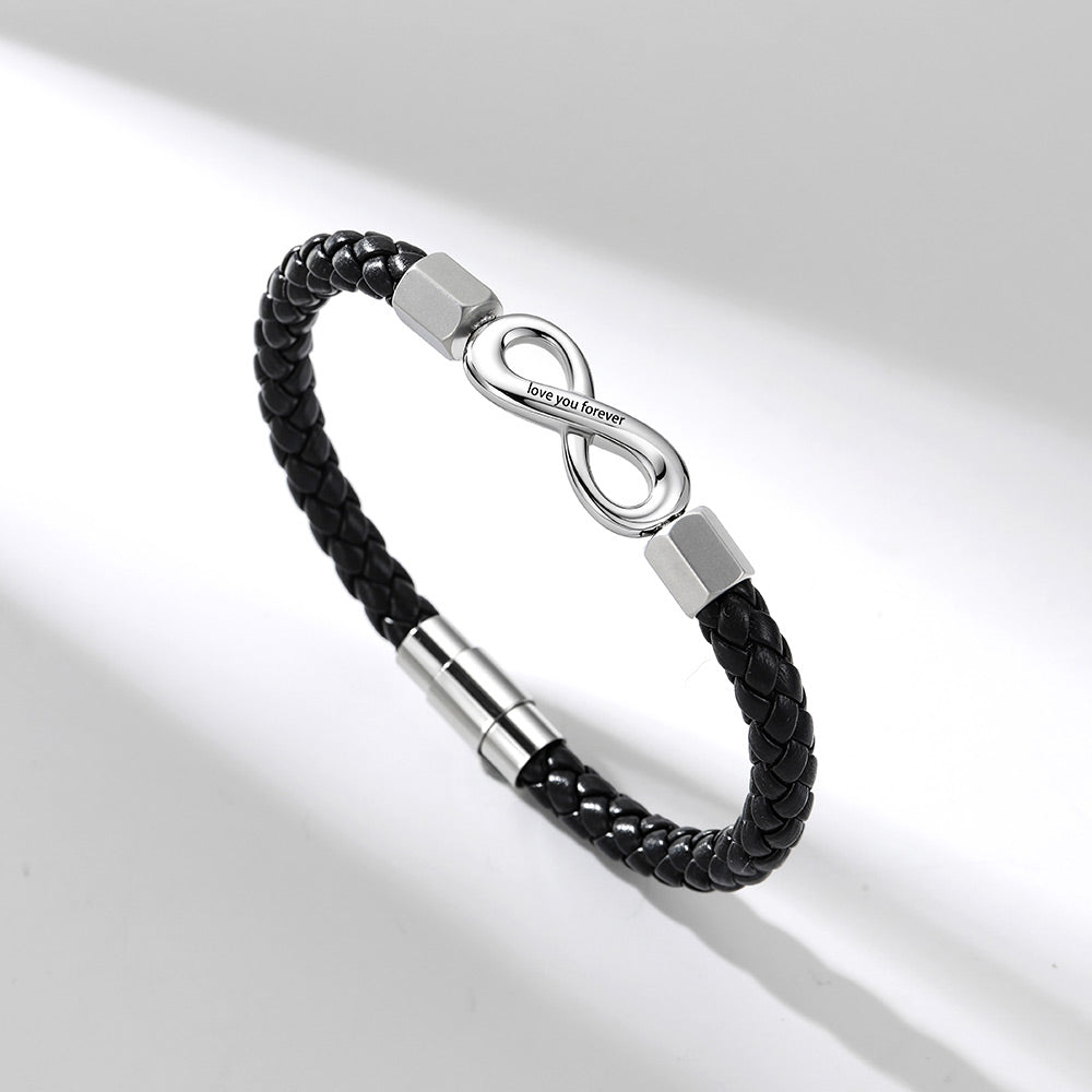 A black braided leather infinity bracelet with a polished silver infinity symbol clasp engraved with 'LOVE YOU BROTHER', shown on a clean white background with soft diagonal shadows.