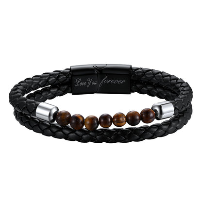 A double-strand men's bracelet featuring a black braided leather wrap, a row of brown tiger's eye beads, and polished silver metal end caps. One of the silver caps is fitted with a black metal clasp engraved with the words 'Love You forever'.