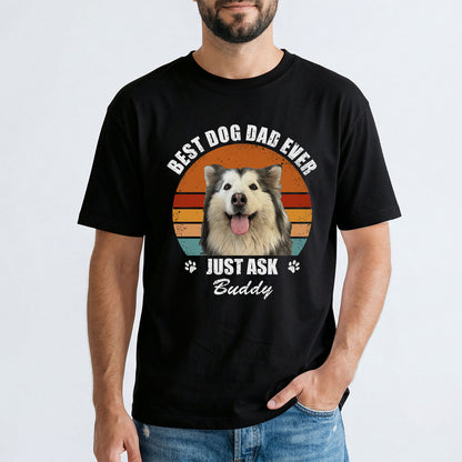 A man wearing a black custom dog t-shirt with a cat graphic and text.
