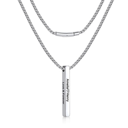 A silver-toned bar necklace featuring a box chain and a slim vertical bar pendant engraved with the names 'Amelia & Henry' and 'Love & Forever', shown on a plain white background.