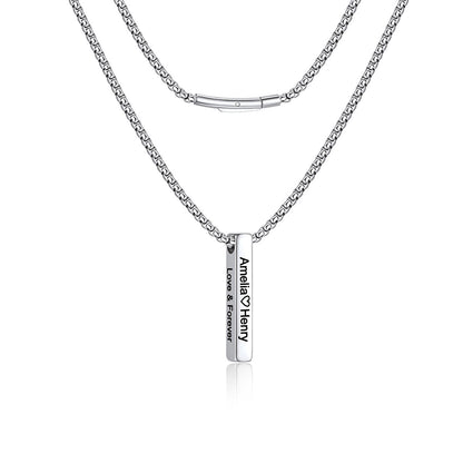 A silver-toned engraved bar necklace featuring a classic box chain and a flat rectangular pendant engraved with 'Annelie & Henry' and 'LOVE & FOREVER'.