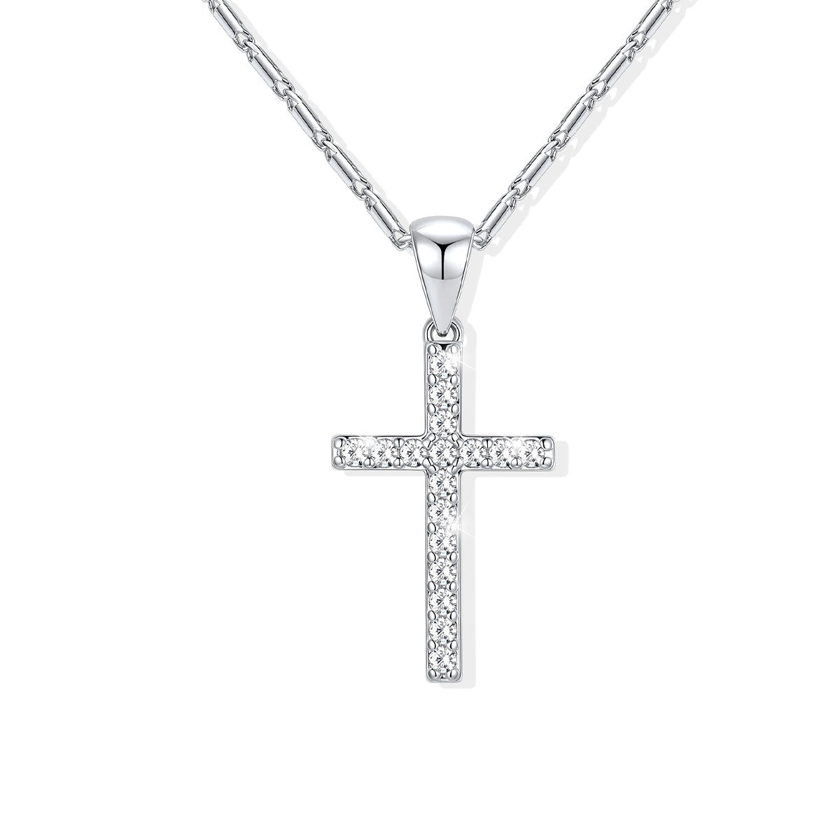 A silver cross necklace paved with small clear stones, hanging from a silver chain against a plain white background.