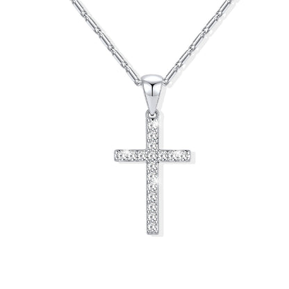 A silver cross necklace paved with small clear stones, hanging from a silver chain against a plain white background.