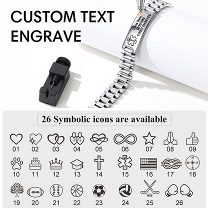 A silver metal link bracelet with a custom engraved ID tag, shown alongside a black text engraver tool and a graphic explaining that 26 symbolic icons are available for customization.