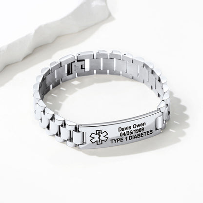 A silver stainless steel link medical alert bracelet with a personalized ID plate engraved with a Star of Life symbol, the name 'Davis Owen', date '04/25/1989', and 'TYPE 1 DIABETES'.