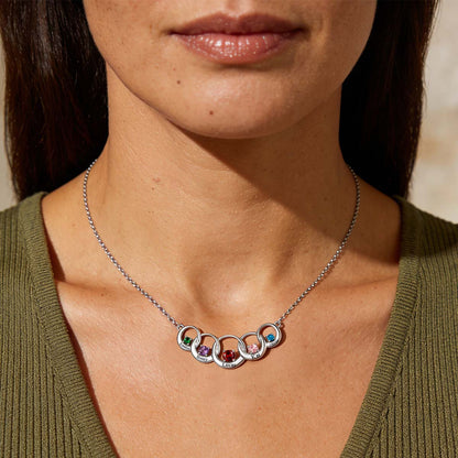 A woman Wearing Name Family Birthstones Necklace