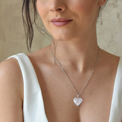 A woman wearing Personalized Photo Rose Heart Locket Necklace