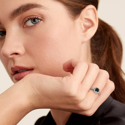 A Woman Wearing Round Cubic Zirconia Engagement Rings