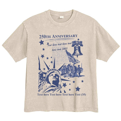 Beige t-shirt with blue graphic design featuring the Statue of Liberty and text on a white background