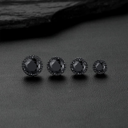 Black CZ Halo stud earrings arranged on a dark textured surface