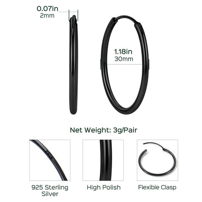 Black hoop earrings with measurements and material details on a white background