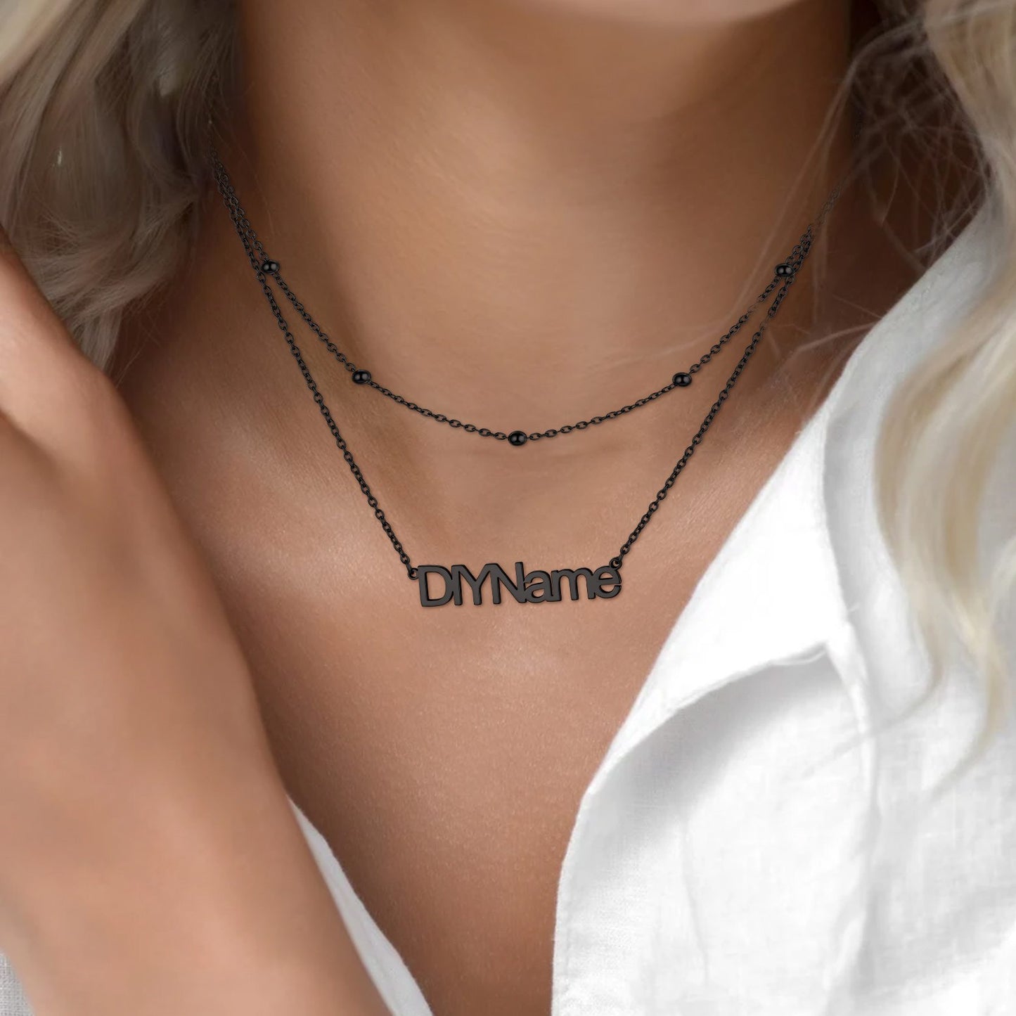 Black layered name Necklace with 'DIYName' pendant on a model wearing a white shirt