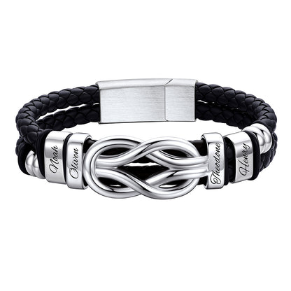 Black leather bracelet with silver infinity symbol and engraved names on a white background