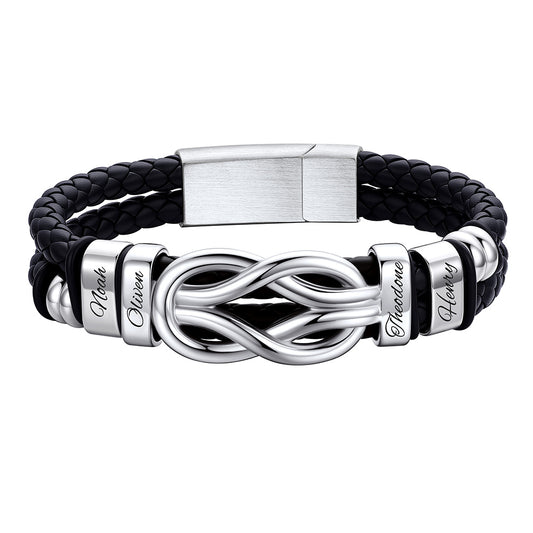 Black leather bracelet with silver infinity symbol and engraved names on a white background