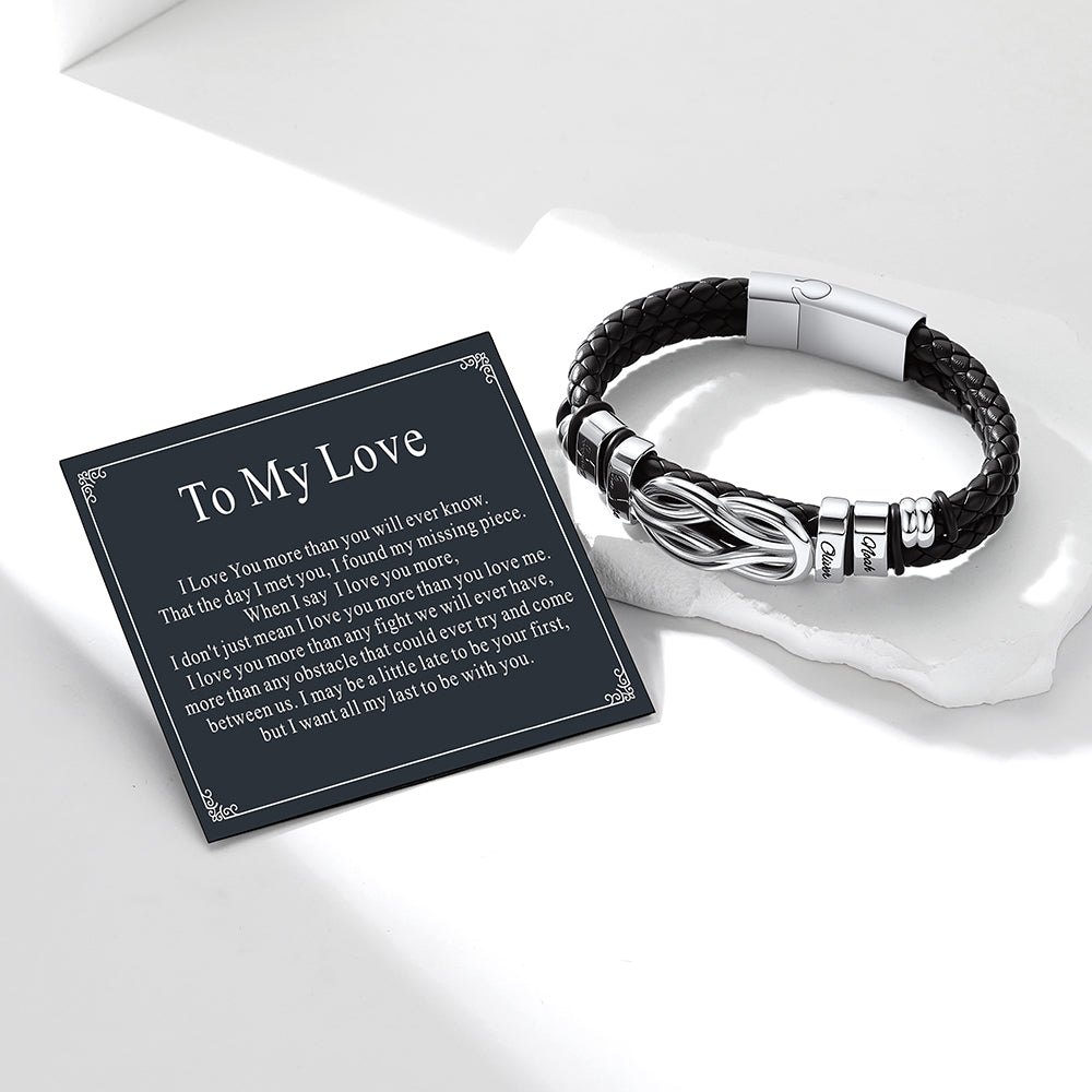 Black love knot leatherbracelet with silver accents on a white surface, accompanied by a 'To My Love' card.