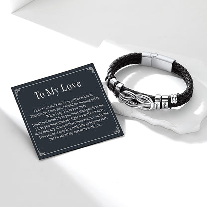 Black love knot leatherbracelet with silver accents on a white surface, accompanied by a 'To My Love' card.