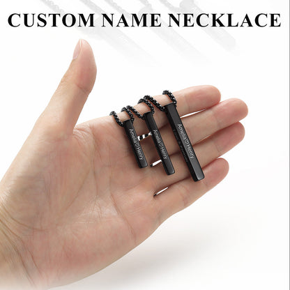 Three black custom name necklaces with ball chains are displayed on an open hand to show scale. The image includes text overlays reading 'CUSTOM NAME NECKLACE' and 'Carry every word close to heart' with feature bullet points.