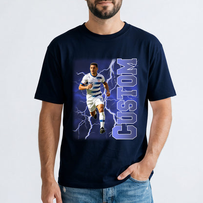 Person wearing a navy blue t-shirt with a custom photo soccer player t shirton a white background.