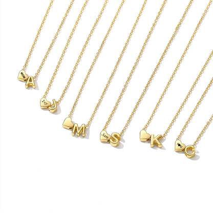 Gold necklaces with heart-shaped letter pendants