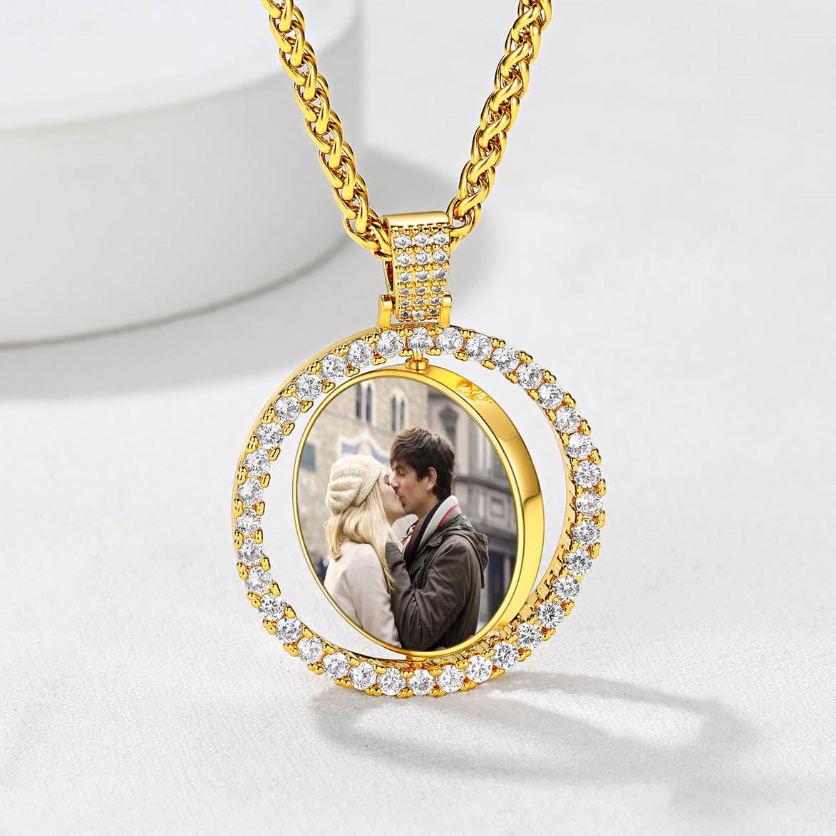 Cubic Zirconia Gold picture necklace with a round pendant featuring a photo of two people kissing on a white background