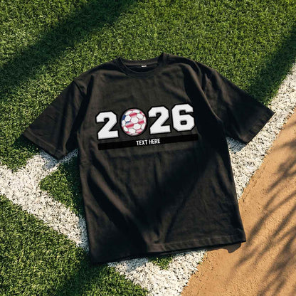Custom Black 2026 world cup t-shirt with '2026' design on grass