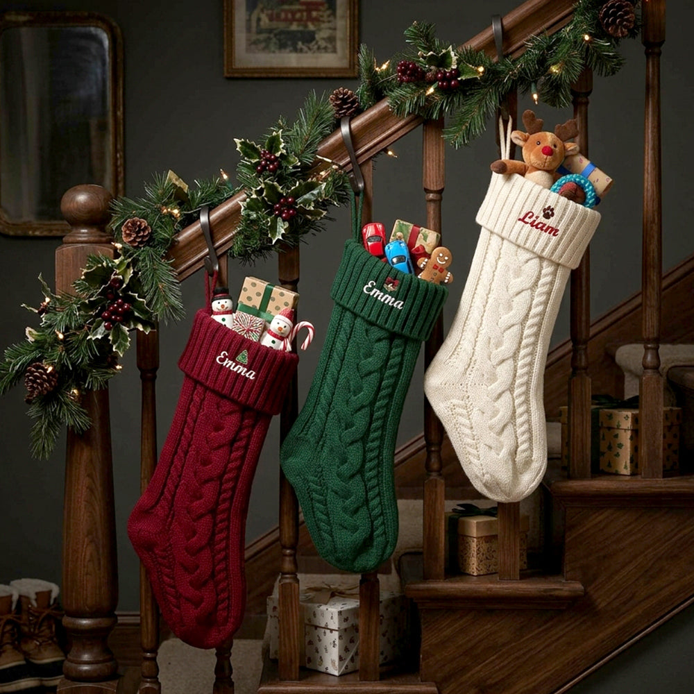 Family holding Personalized Embroidered Name Cable Knit Christmas Stocking with Holiday Decor on the stairs