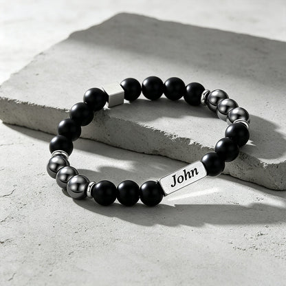 Custom Magnetic Hematite Beaded Bracelet on a cement background