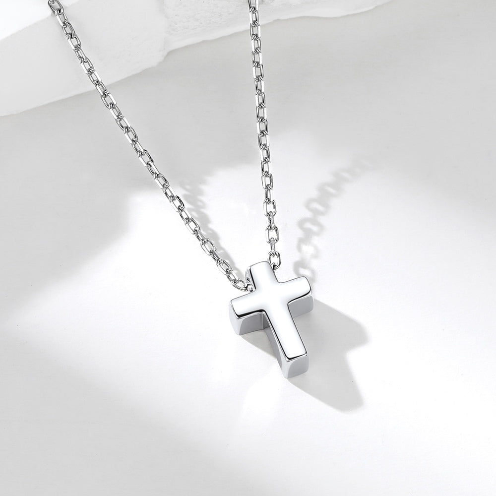 Custom Silver cross necklace on a white background