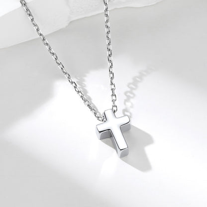 Custom Silver cross necklace on a white background