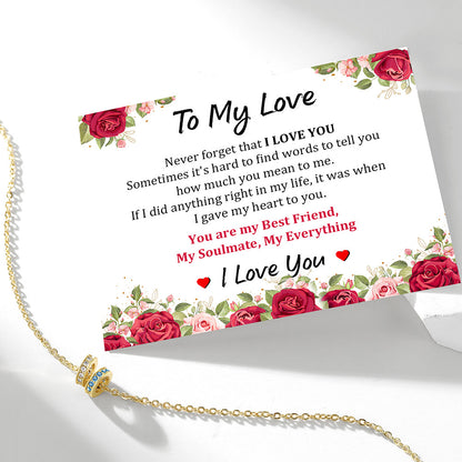Custom Stacking Birthstone Necklace with a sentimental card on a white background