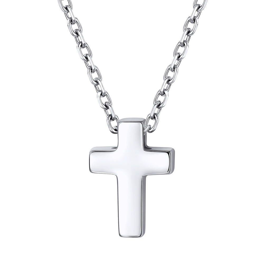 Dainty Silver cross pendant on a chain against a white background