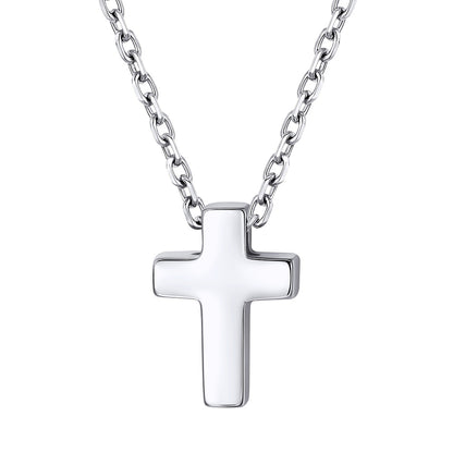 Dainty Silver cross pendant on a chain against a white background
