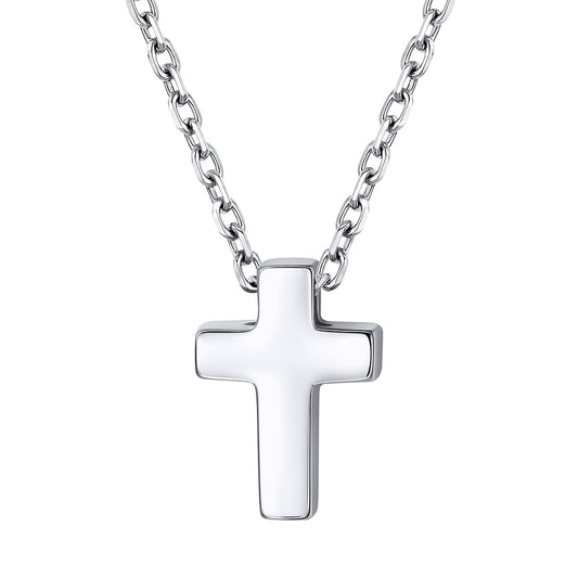 Dainty Silver cross pendant on a chain against a white background