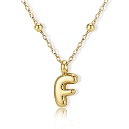 Gold Bubble Initial F Necklace for Women on a white background