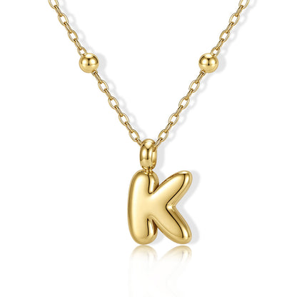 Gold Bubble Initial K Necklace for Women on a white background