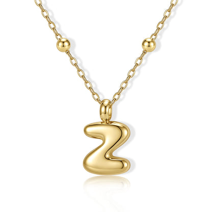 Gold Bubble Initial Z Necklace for Women on a white background