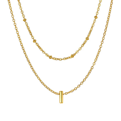 Gold Layered initial I necklace on a white background