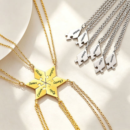 Gold and silver puzzle piece necklaces with engraved names on a light background