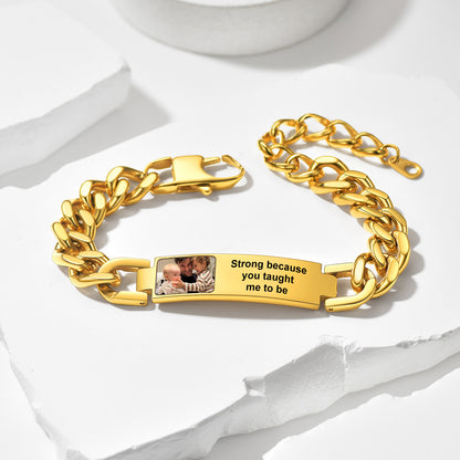 Gold chain photo bracelet with engraved message and photo on a white background