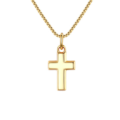 Gold cross pendant on a gold chain against a white background