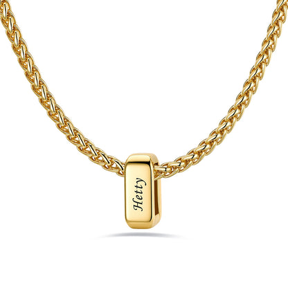 Gold custom name necklace with 1 rectangular pendant engraved on a white background