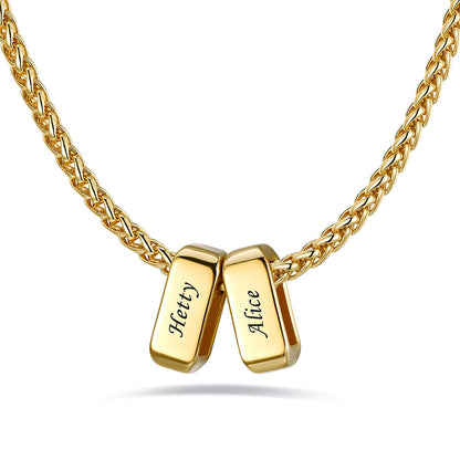 Gold custom name necklace with 2 rectangular pendant engraved on a white background