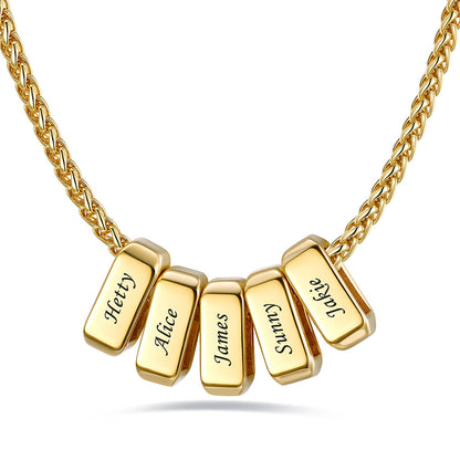 Gold custom name necklace with 5 rectangular pendant engraved on a white background