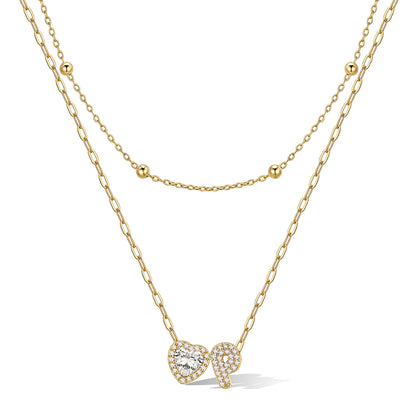Gold cz bubble initial P necklace with a heart-shaped pendant on a white background