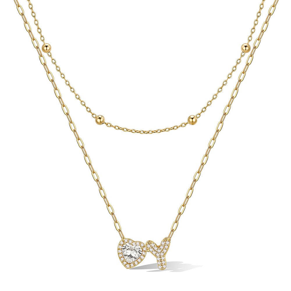 Gold cz bubble initial Y necklace with a heart-shaped pendant on a white background