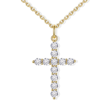 Gold cz cross necklace with clear gemstones on a white background