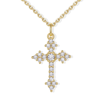Gold cz cross pendant necklace on a white background